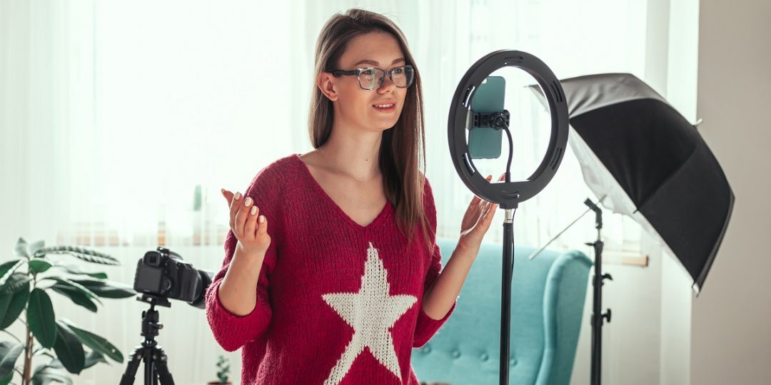Young woman getting ready to shoot video for tiktok